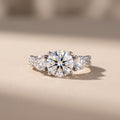 White Metal Round Moissanite Three-Stone Engagement Ring