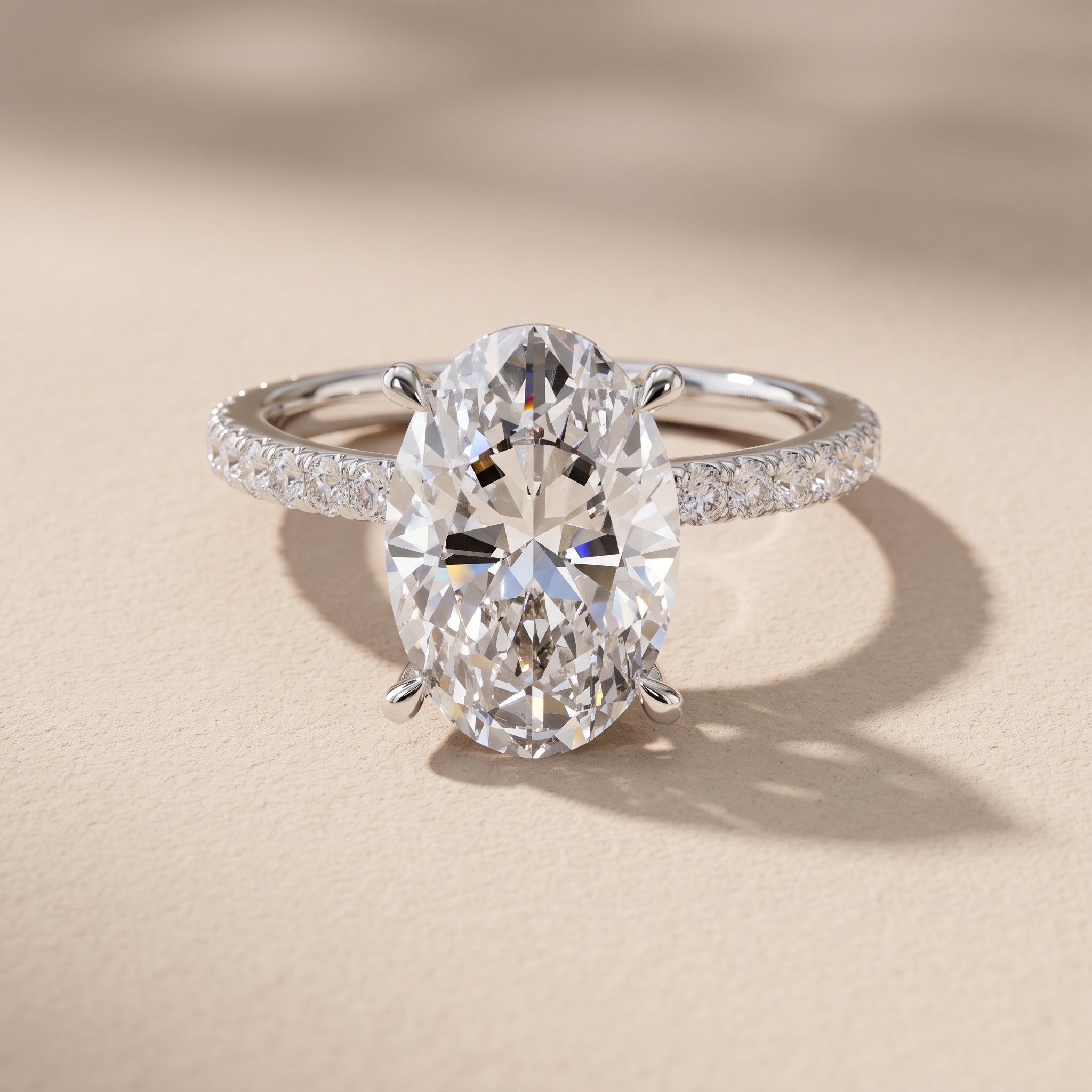White Gold Oval Cut Moissanite Engagement Ring with Pavé Band