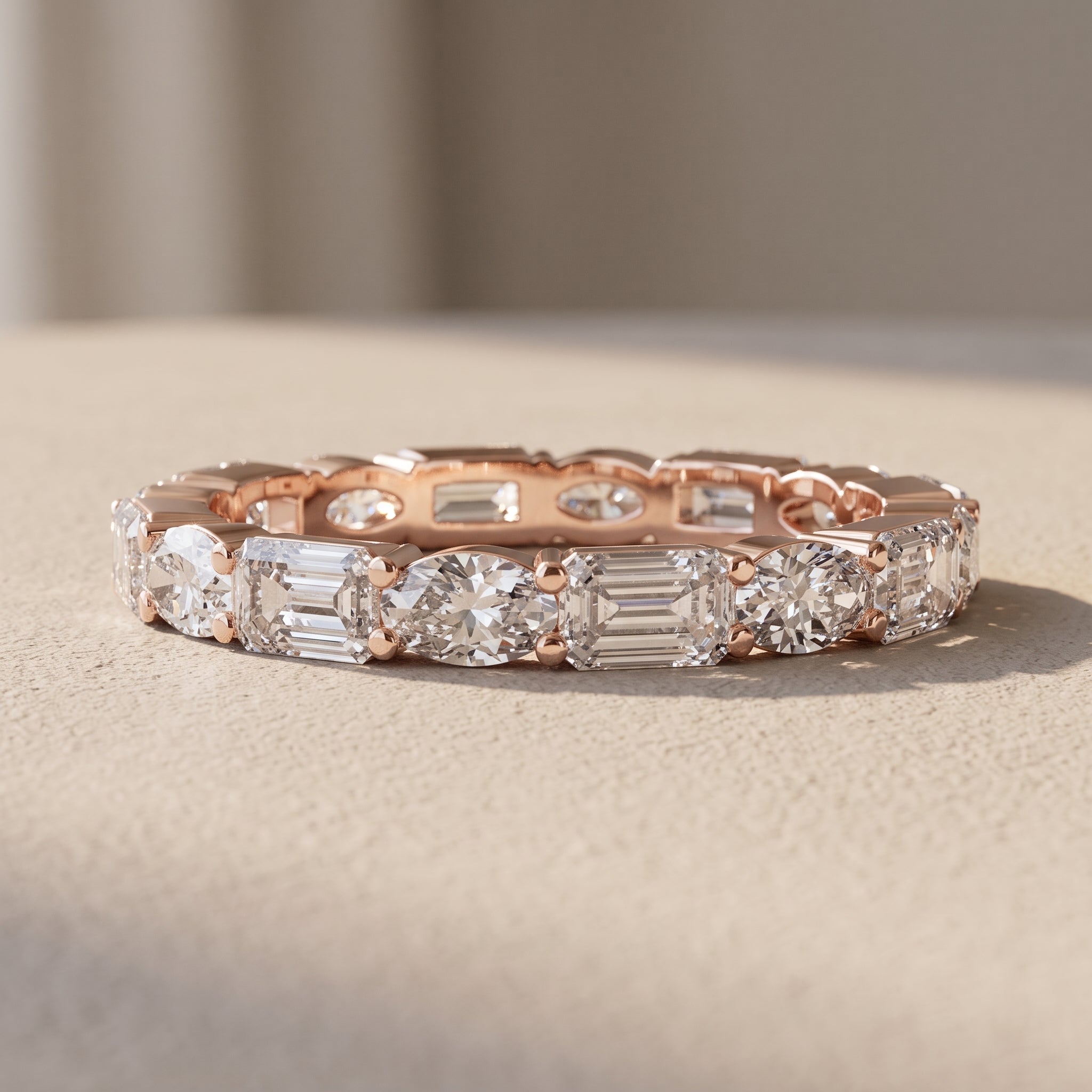 Rose Gold Alternating Oval & Emerald Cut Moissanite Eternity Band