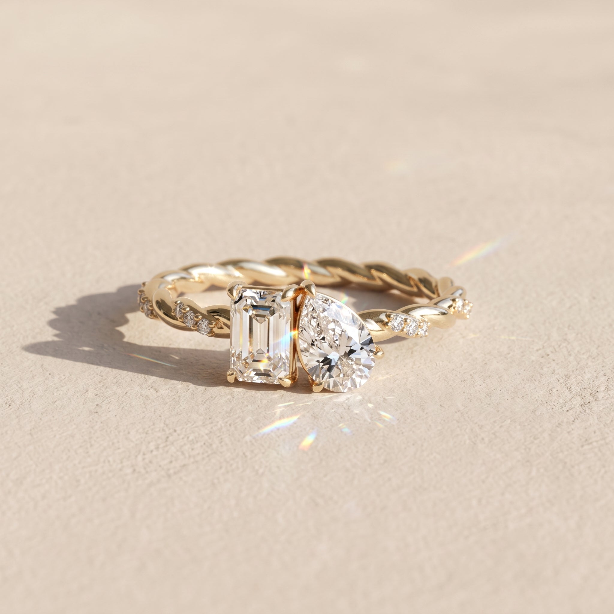 Yellow Gold Emerald & Pear Cut Moissanite Twist Ring