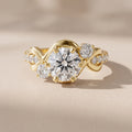 Yellow Gold Round Moissanite Twisted Three-Stone Engagement Ring