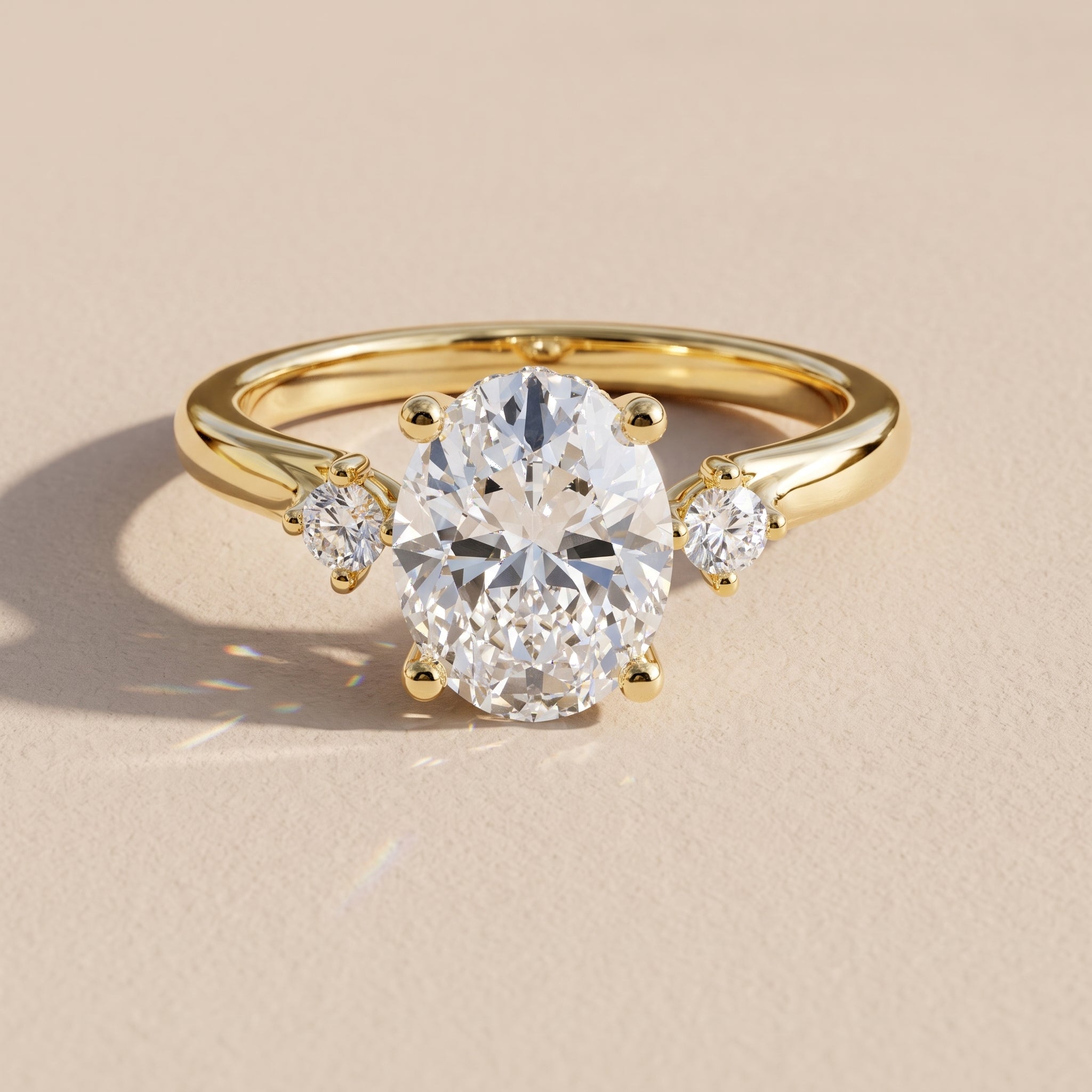 Yellow Gold Oval Moissanite Three-Stone Engagement Ring