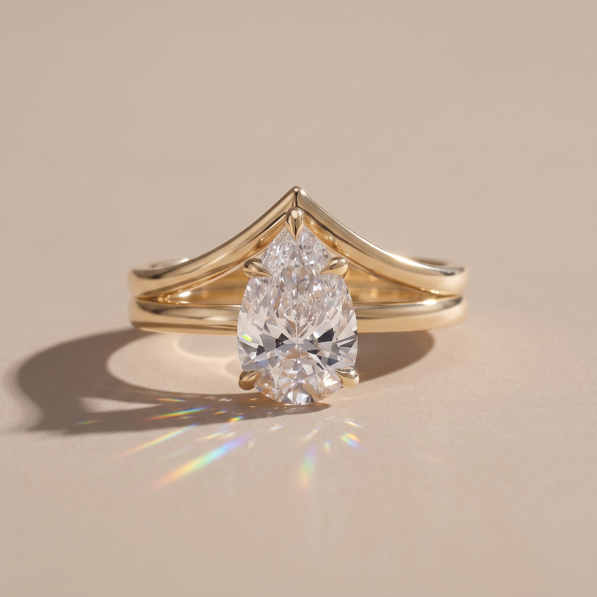 Yellow Gold Pear Cut Moissanite Engagement Ring with Chevron Band