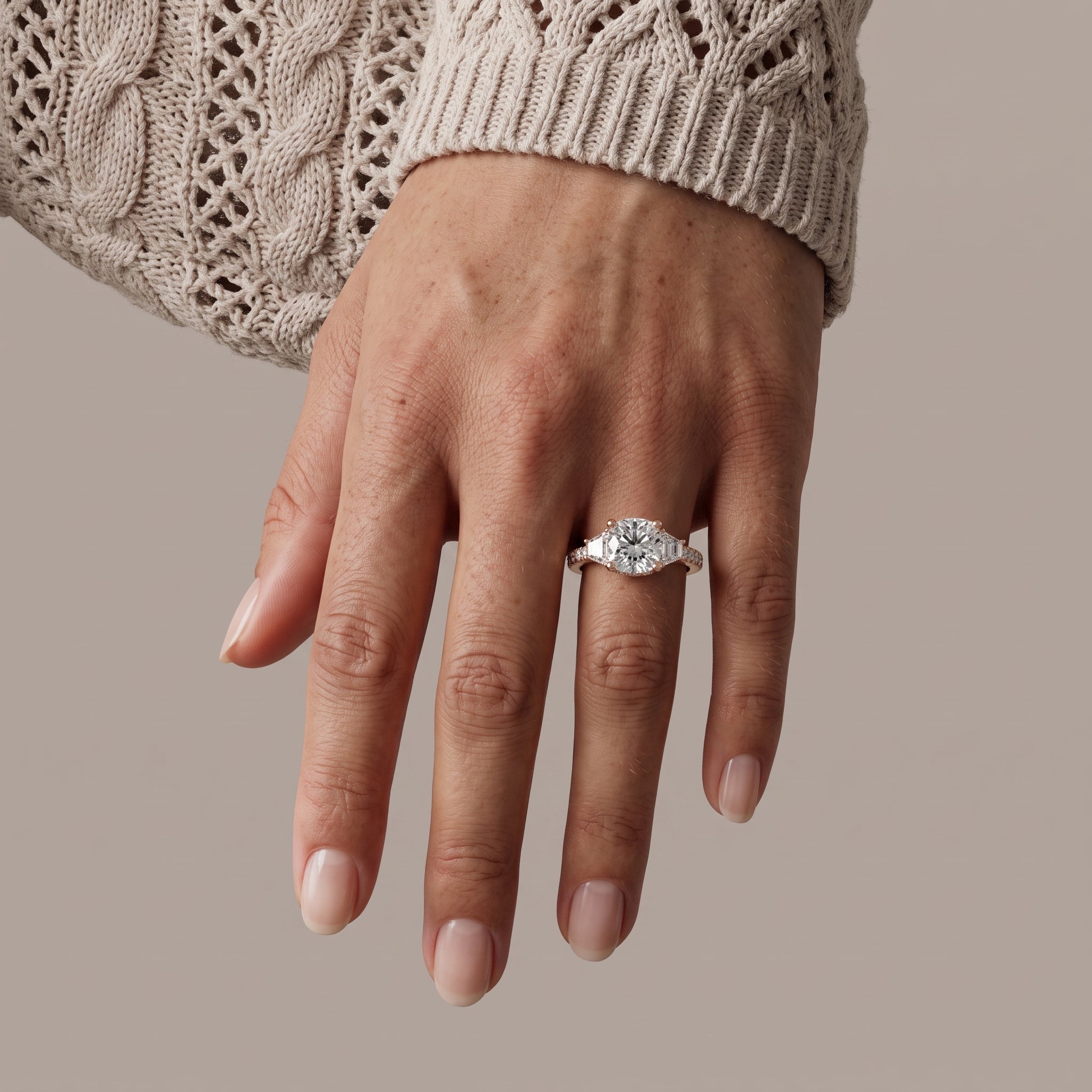 Rose Gold Round Moissanite Engagement Ring with Tapered Side Stones