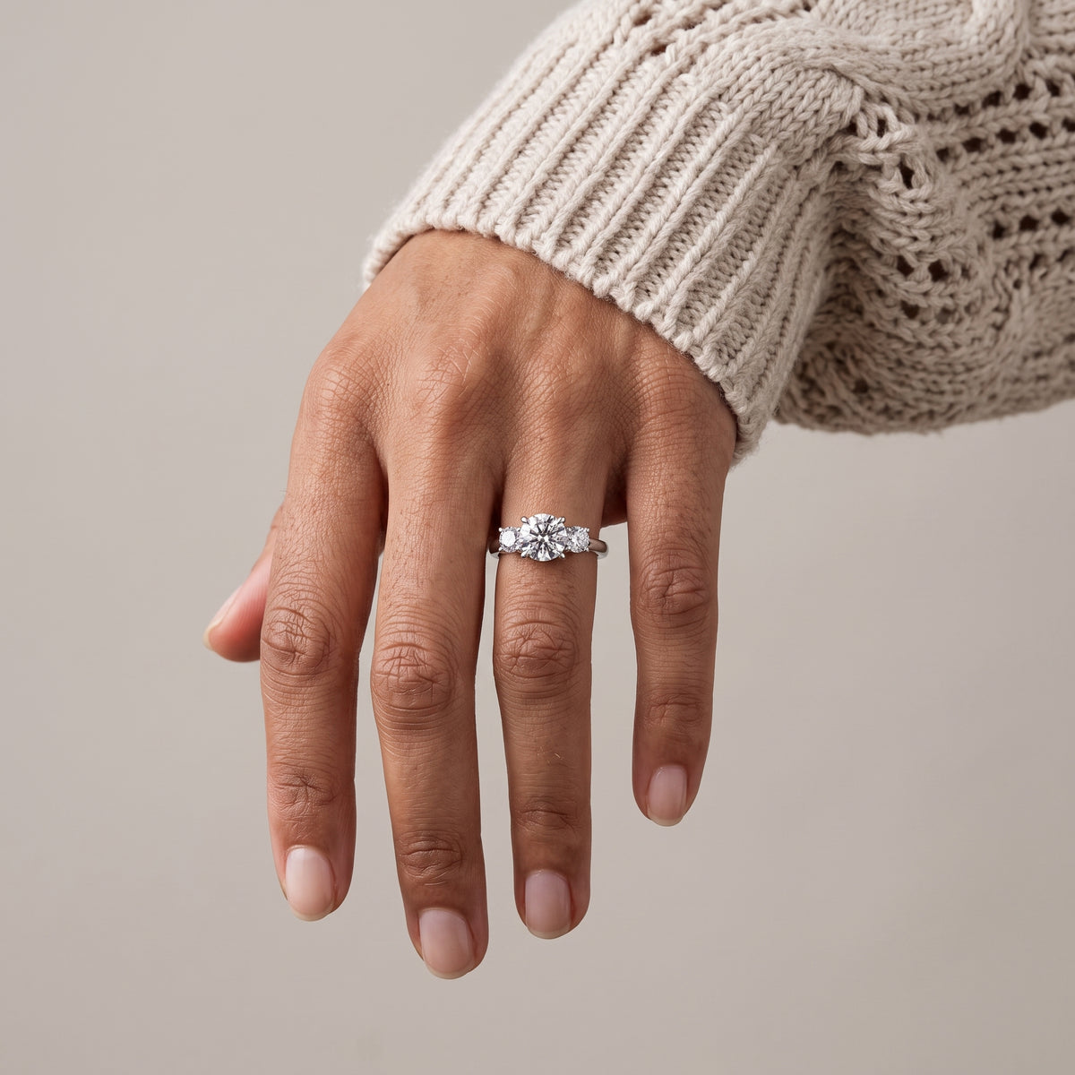 White Metal Round Moissanite Three Stone Engagement Ring