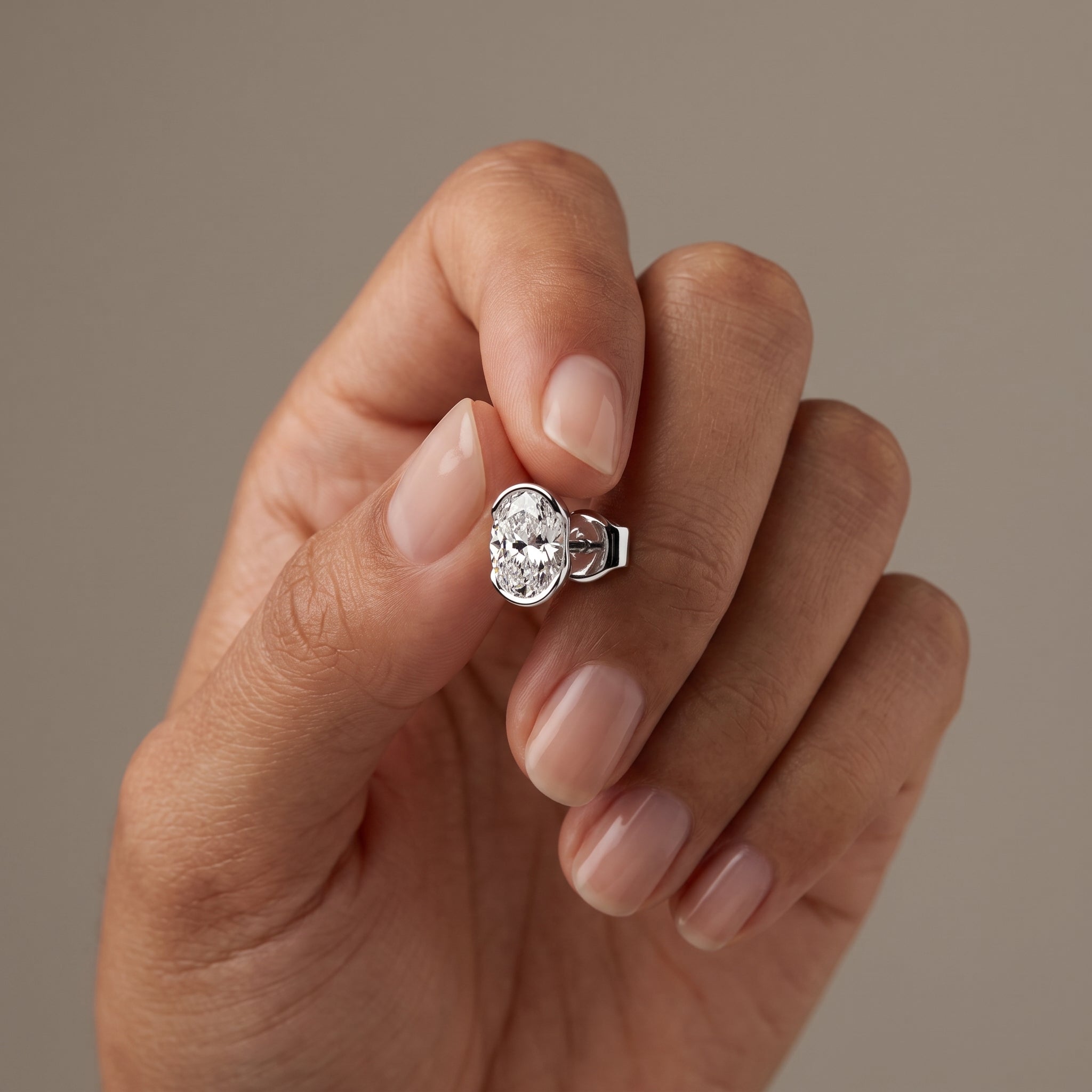 White Metal Oval Cut Moissanite Stud Earrings