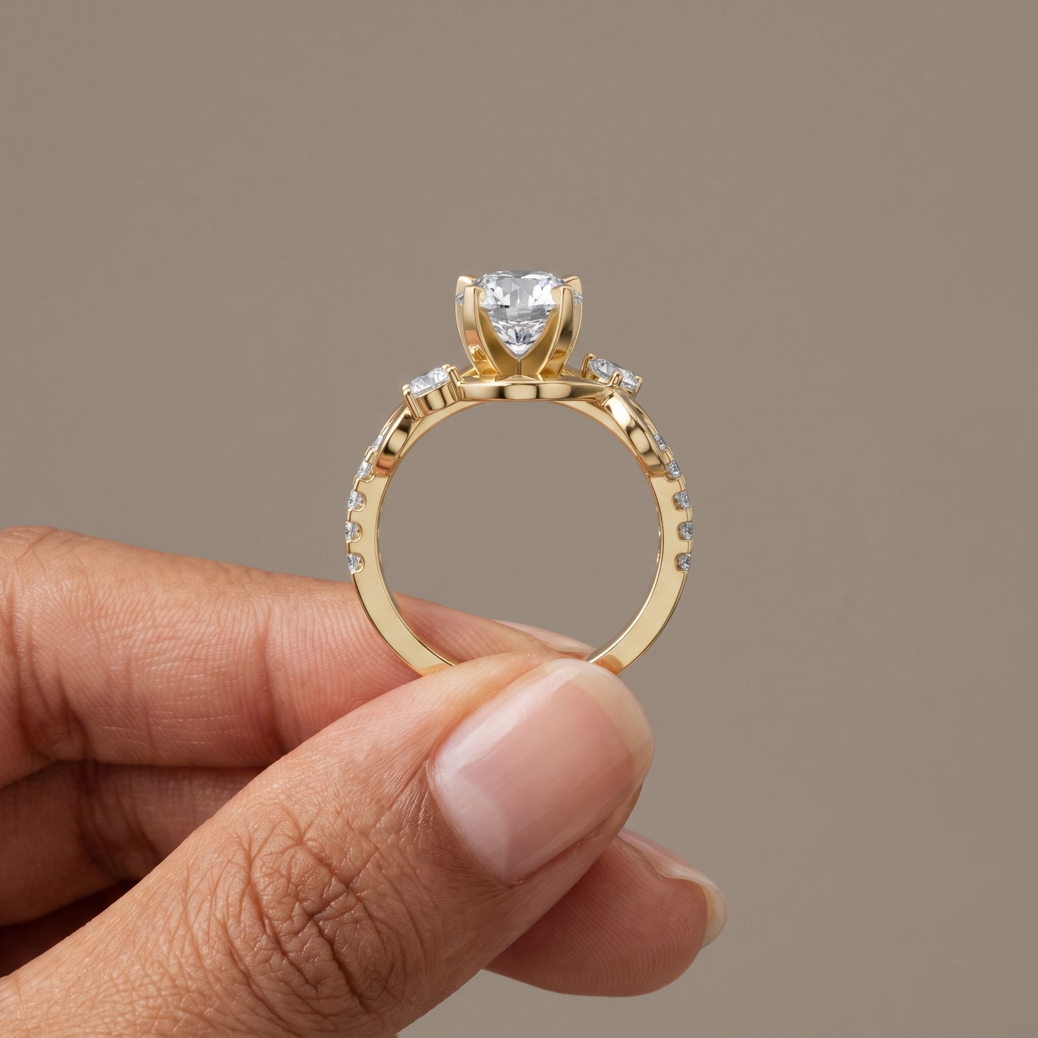Yellow Gold Round Moissanite Twisted Three-Stone Engagement Ring
