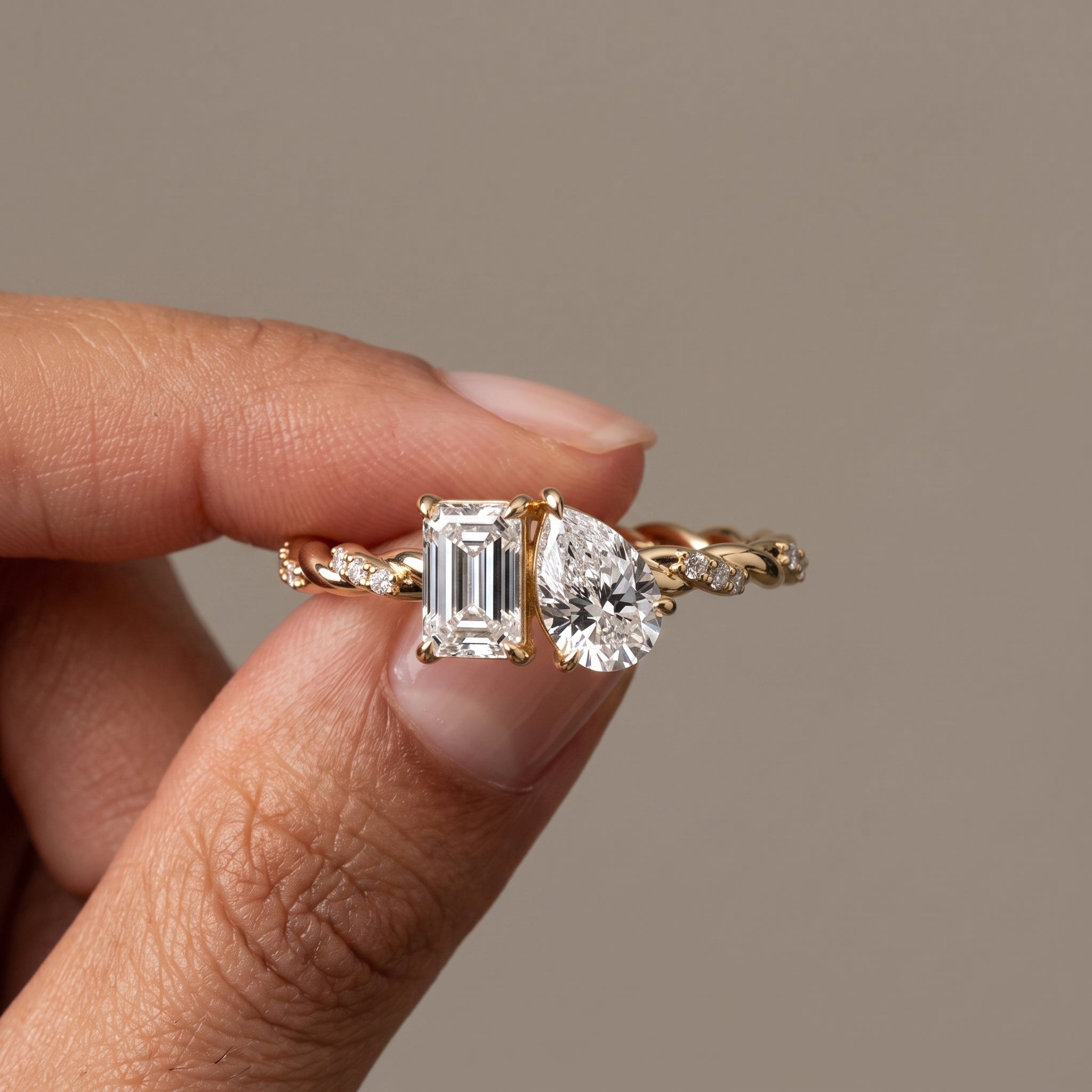 Yellow Gold Emerald & Pear Cut Moissanite Twist Ring