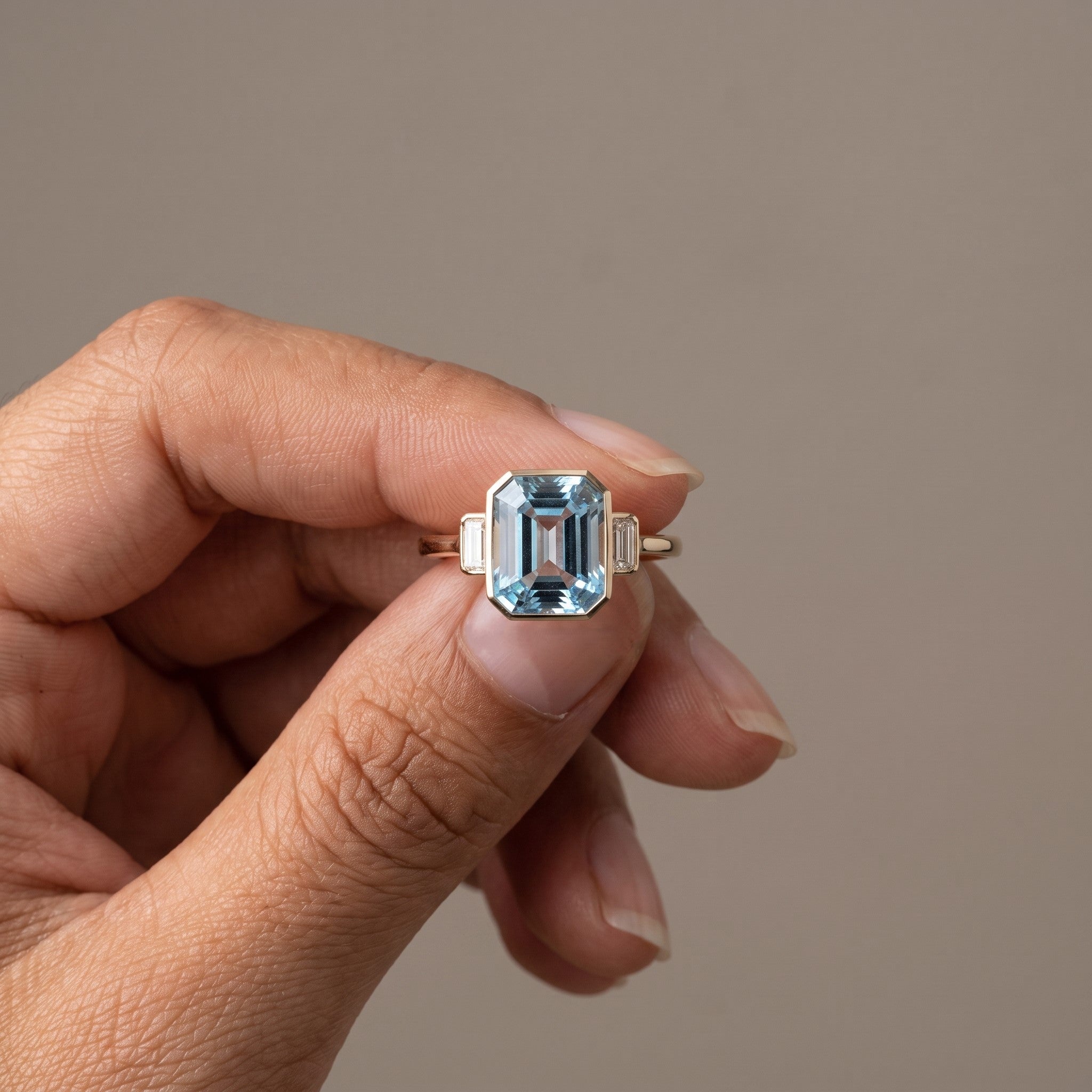 Yellow Gold Emerald Cut Blue Moissanite Three-Stone Ring