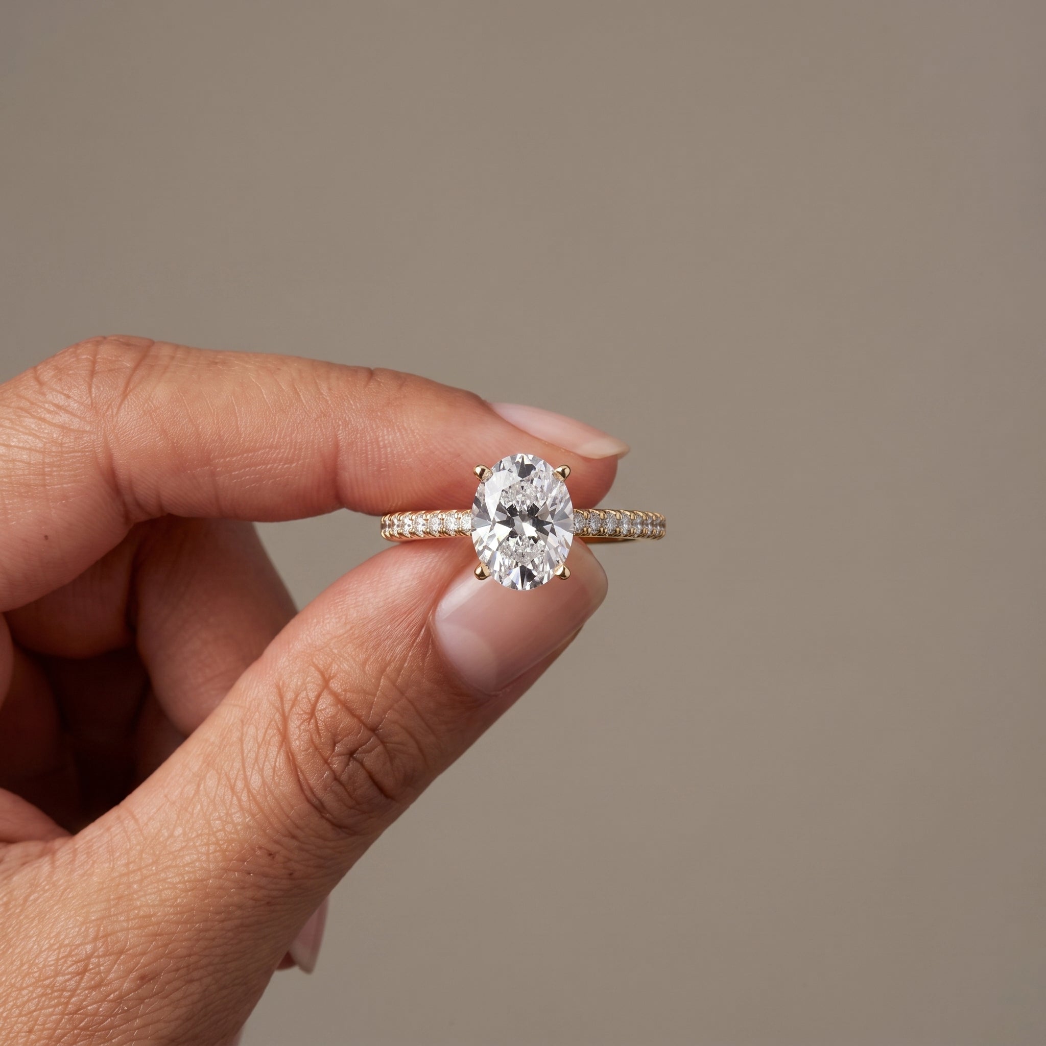 Yellow Gold Oval Cut Moissanite Engagement Ring with Pavé Band