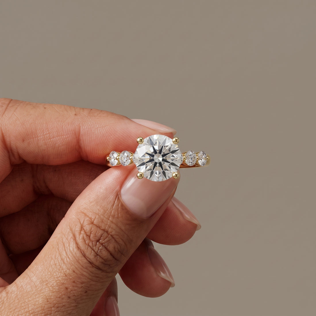 Yellow Gold Round Moissanite Engagement Ring with Side Stones