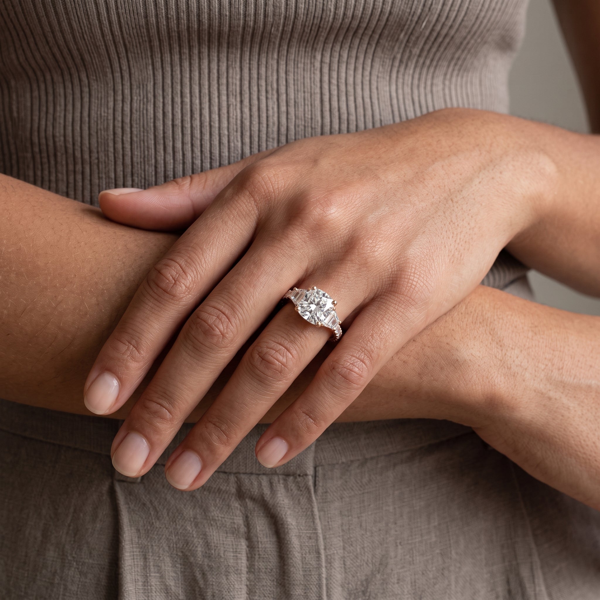 Rose Gold Round Moissanite Engagement Ring with Tapered Side Stones