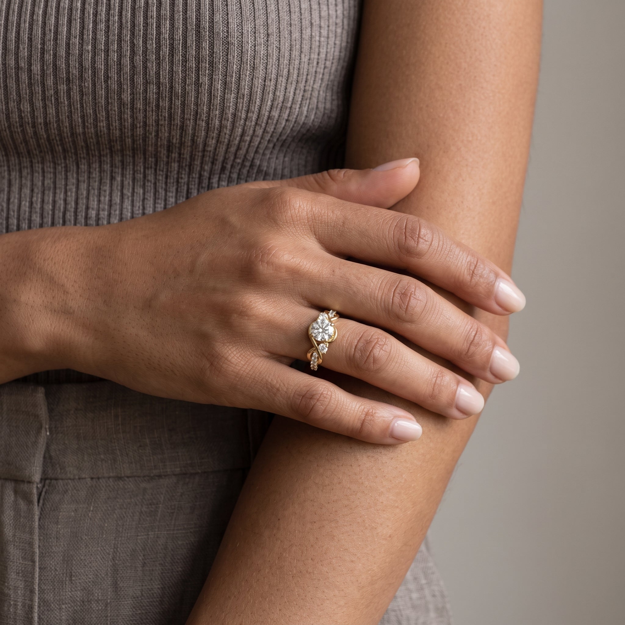Yellow Gold Round Moissanite Twisted Three-Stone Engagement Ring