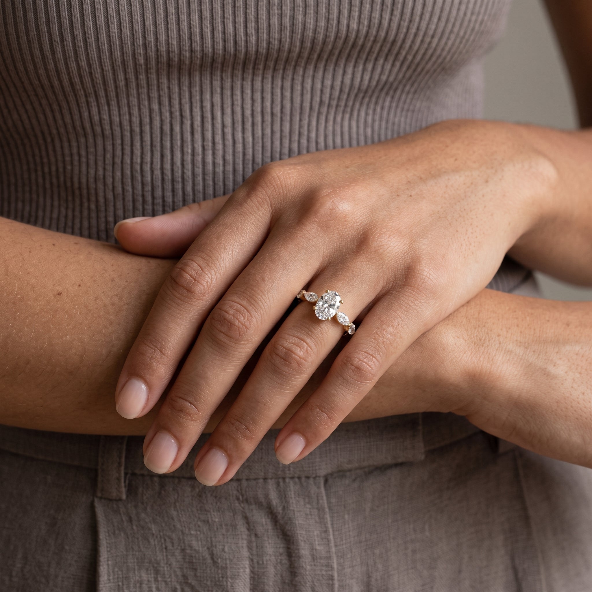 Yellow Gold Oval Moissanite Engagement Ring with Marquise Accents